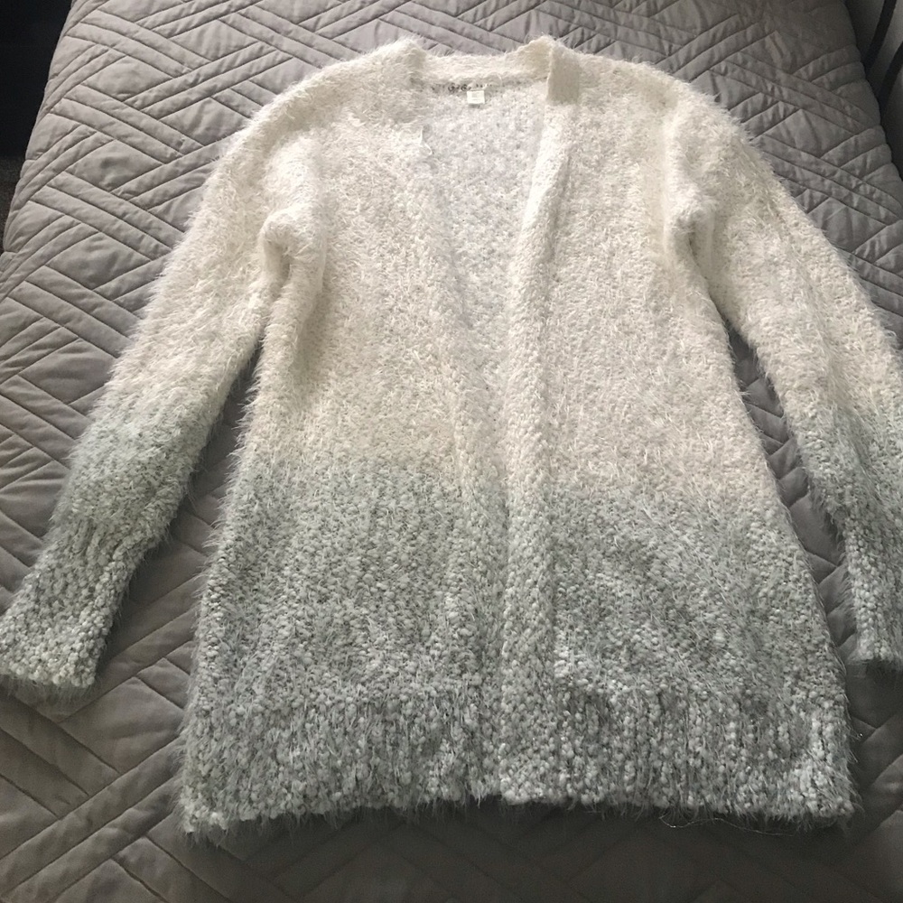White cardigan with gray/gray ombré on the bottom.